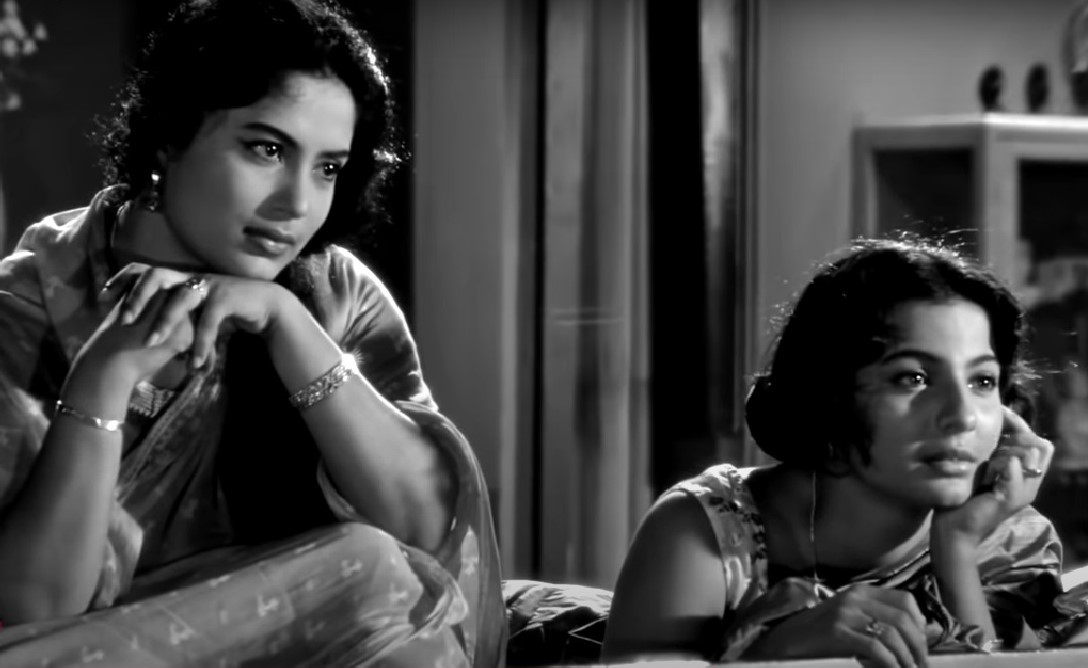 Sumita Sanyal and Tanuja enjoying a song on radio. A still from Deya Neya (1963)